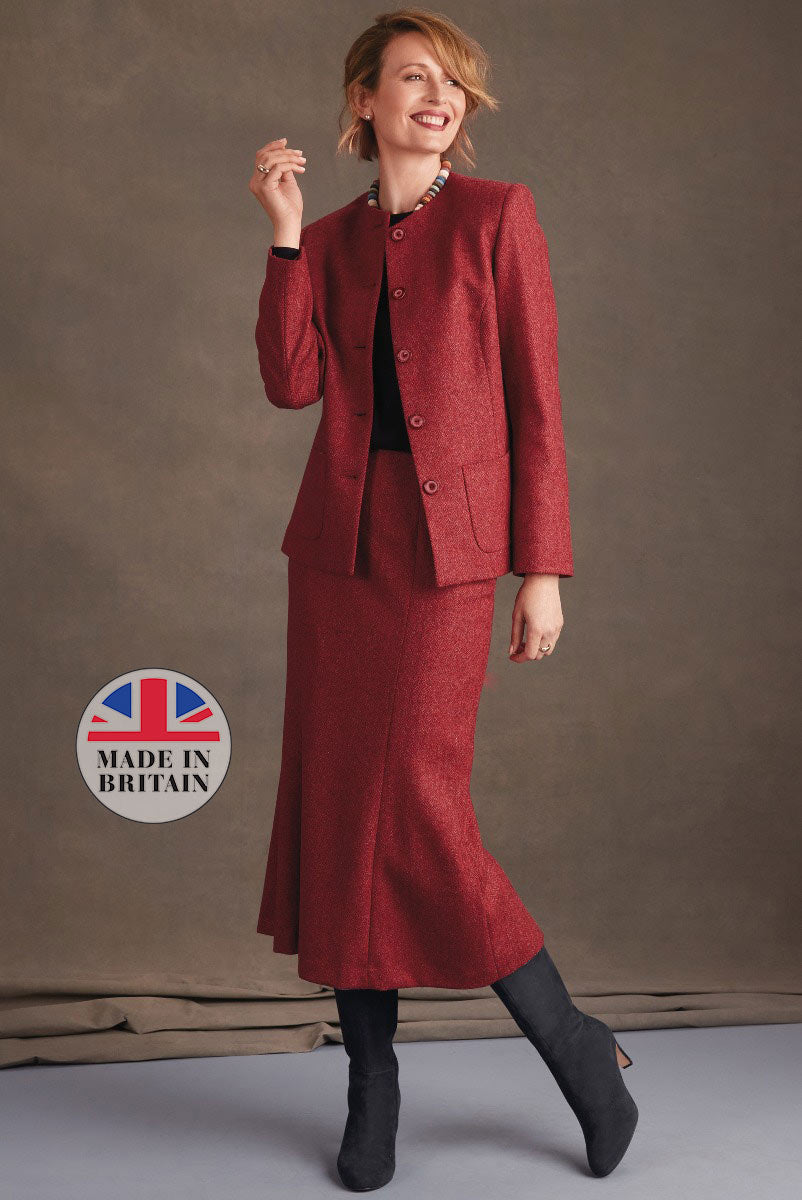 Lily Ella Collection classic style maroon tweed skirt suit with Made in Britain logo, woman modeling elegant jacket and flared skirt paired with black boots.