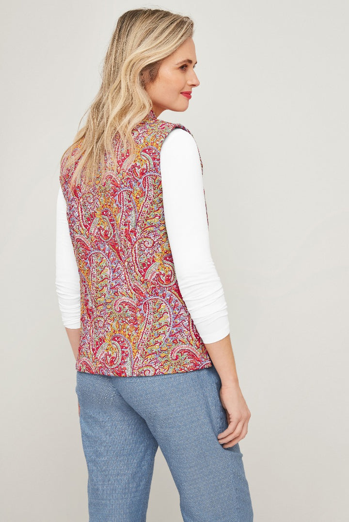 Lily Ella Collection women's paisley quilted gilet in vibrant red and yellow, stylish layering fashion piece, model posing in contemporary casual outfit.