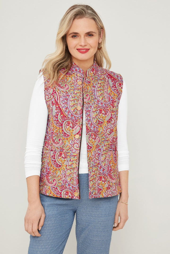 Lily Ella Collection women's paisley print gilet in vibrant red and yellow tones, stylish sleeveless quilted design, casual chic outerwear, paired with white long-sleeve top and blue jeans