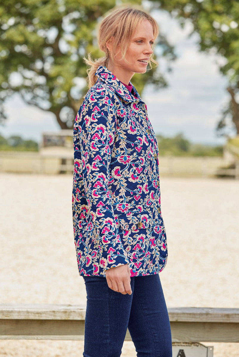 Lily Ella Collection women's autumn fashion with stylish floral patterned navy-blue blouse featuring a classic collar and long sleeves, paired with dark denim jeans, casual outdoor look.