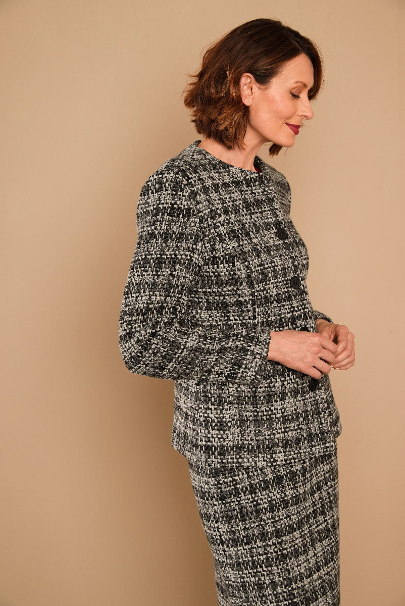 Lily Ella Collection elegant black and white tweed jacket and skirt set on model, sophisticated women's fashion, timeless office wear style