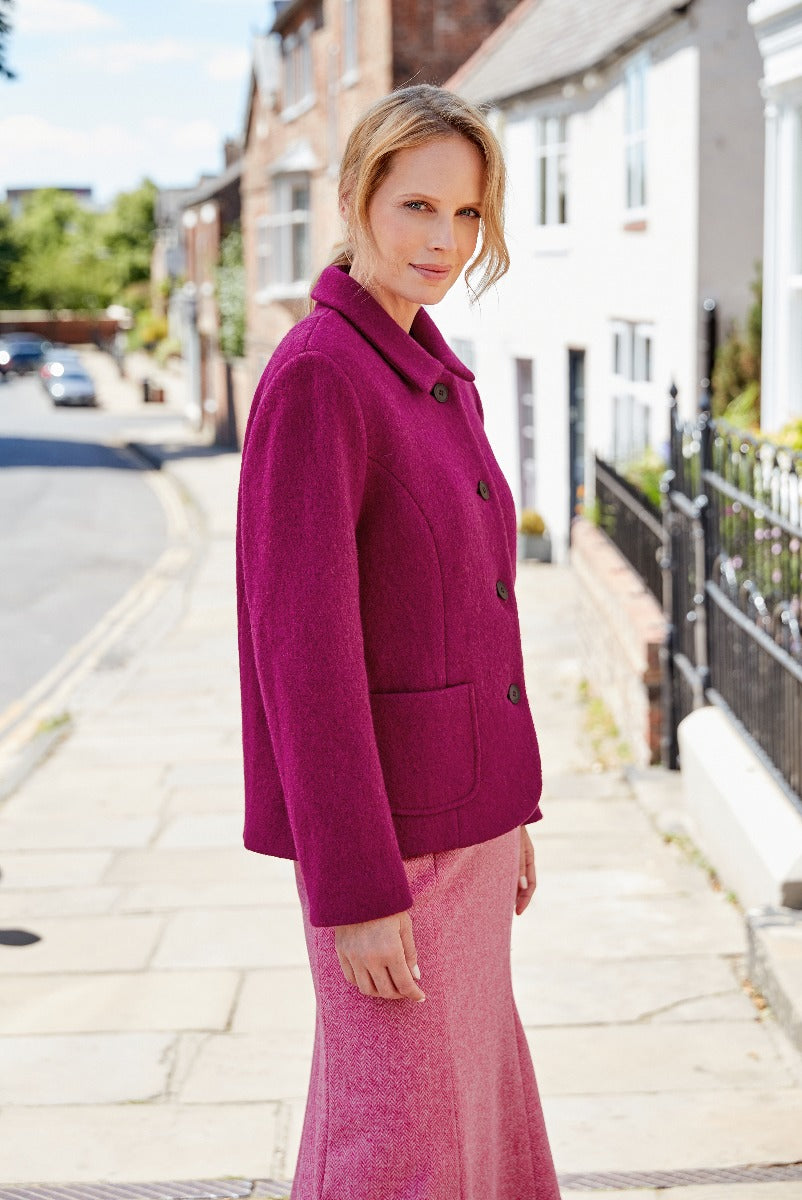 Lily Ella Collection elegant magenta bouclé jacket with button closure paired with a coordinating knee-length skirt, street style fashion for women, autumn-winter style inspiration