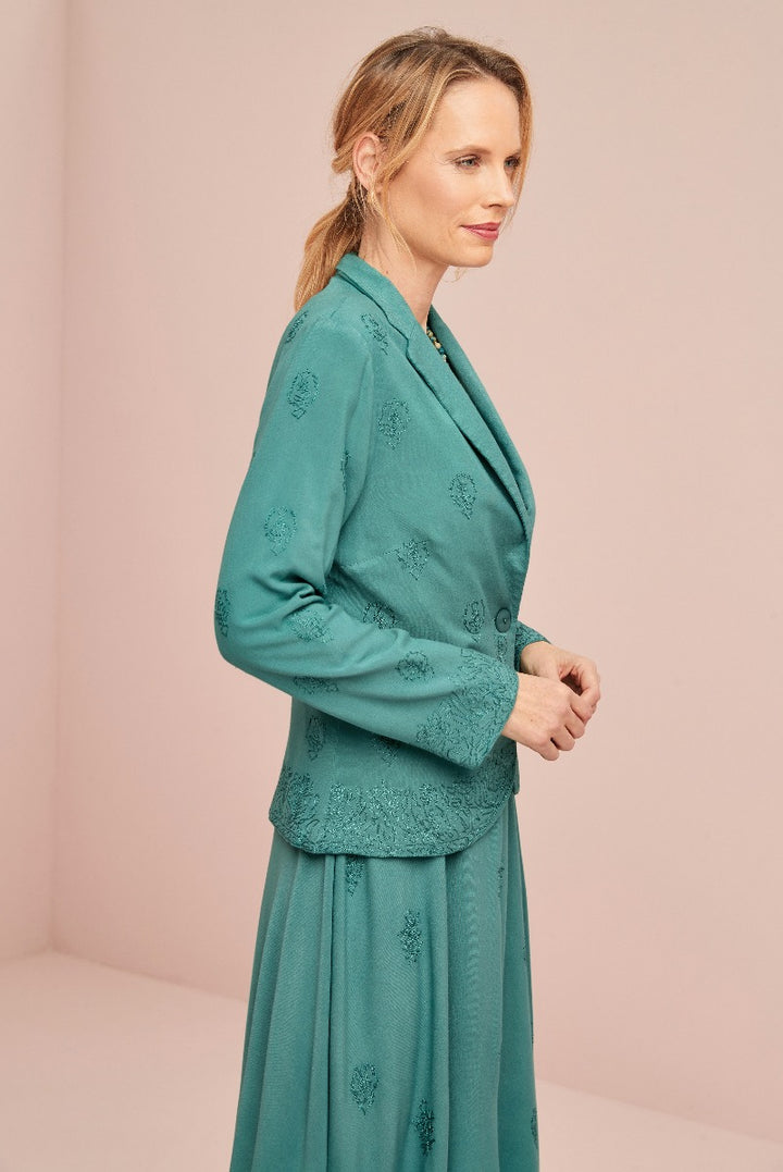 Lily Ella Collection teal embroidered jacket and skirt, elegant women's attire, sophisticated style, detailed floral pattern.
