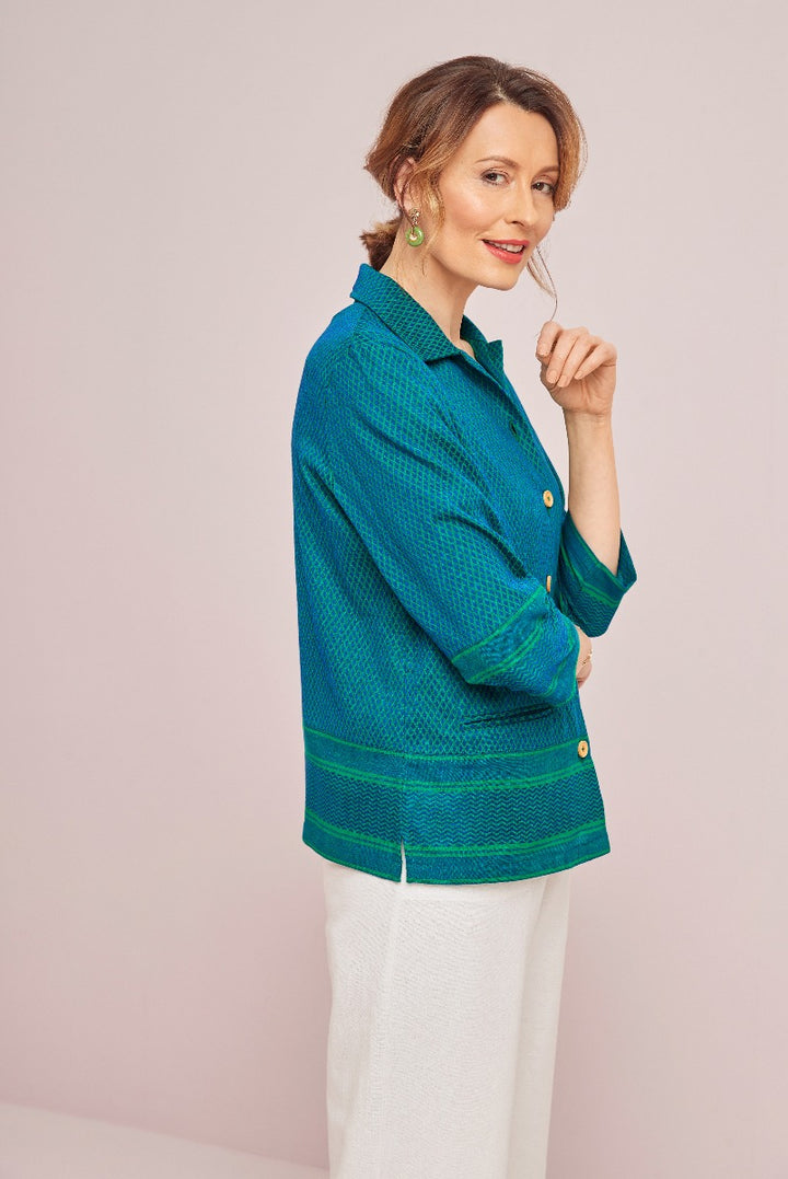 Lily Ella Collection teal textured jacket with button details and white trousers elegant womenswear fashion