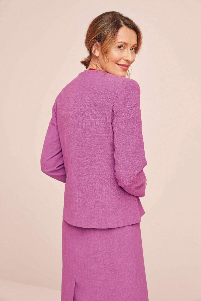 Lily Ella Collection elegant purple women's jacket and skirt set, textured fabric, rear view of stylish outfit.