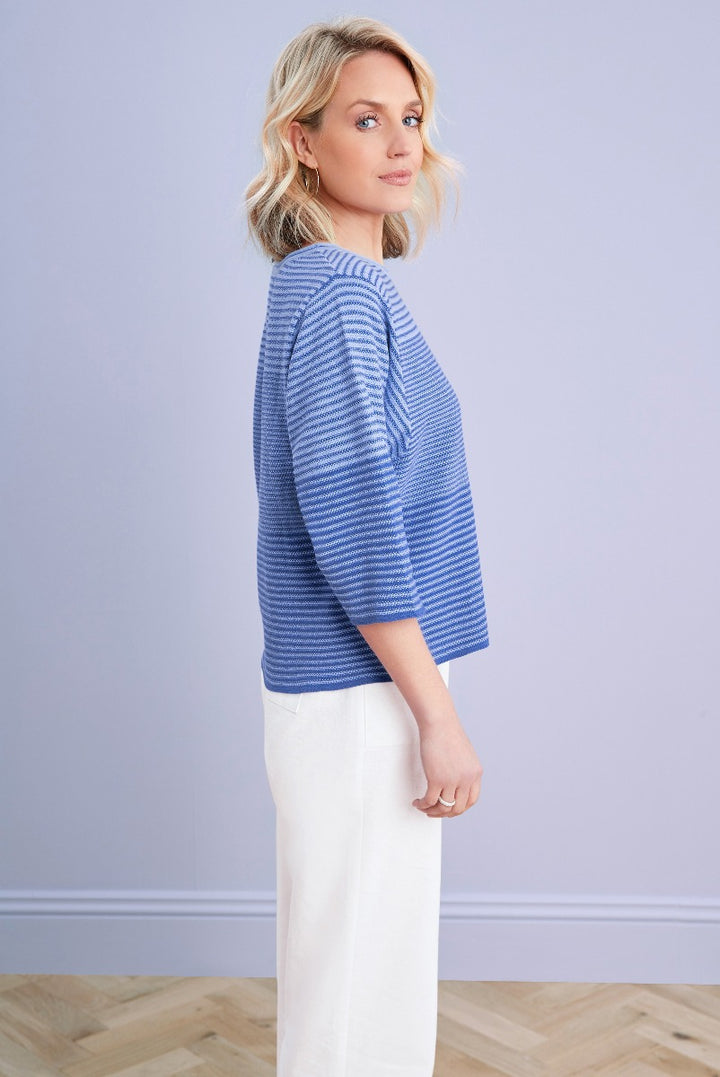 Lily Ella Collection blue striped knit jumper paired with white trousers, featuring three-quarter sleeves and elegant boat neckline.