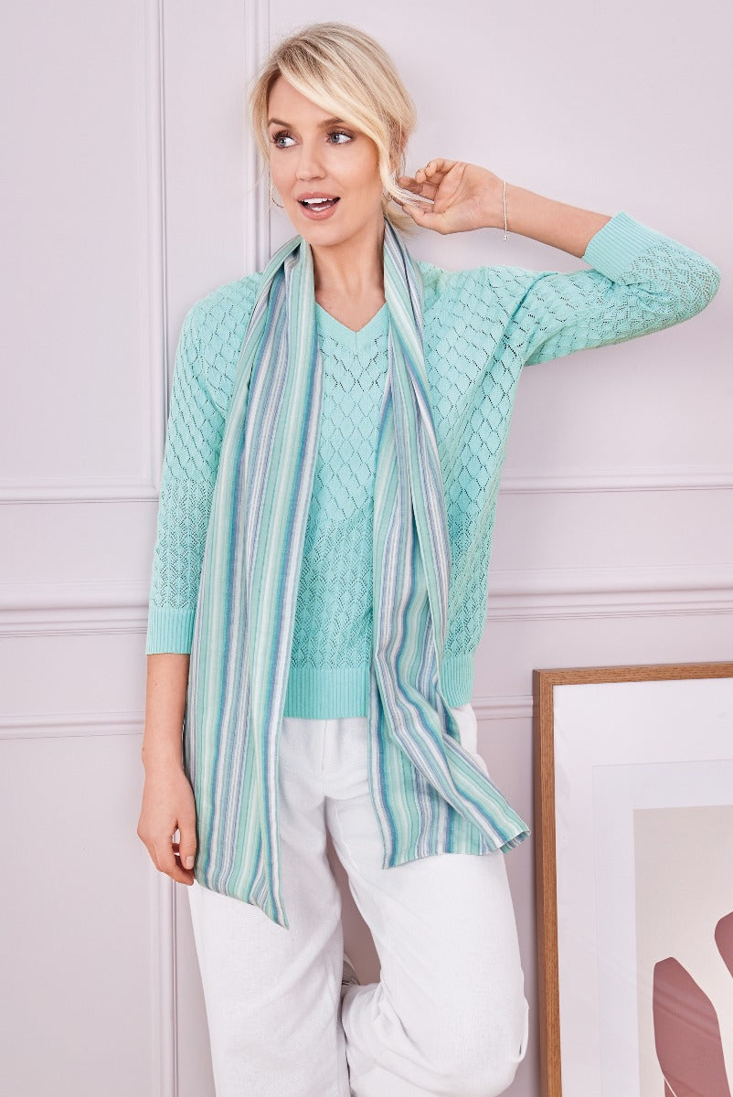 Lily Ella Collection stylish mint green cable knit sweater and striped scarf with comfy white trousers, women's spring fashion ensemble.