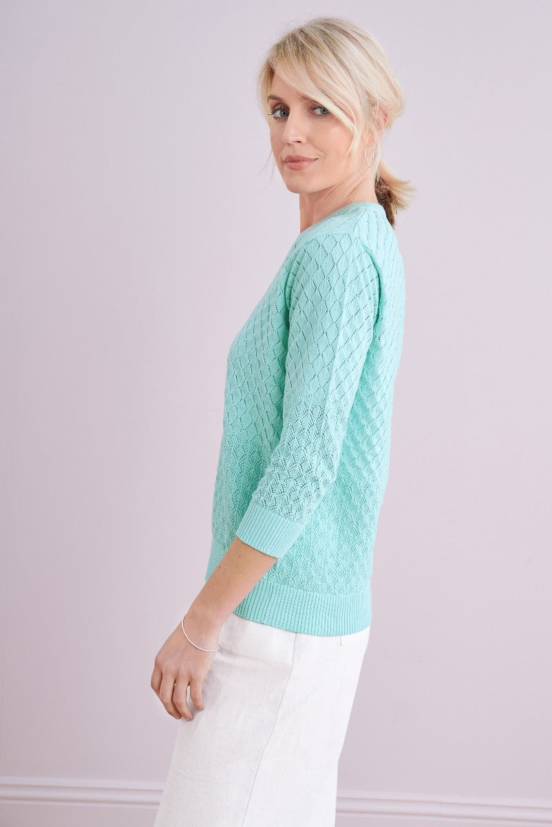 Lily Ella Collection aqua blue cable knit sweater, stylish women's fashion, mid-length sleeves, paired with white trousers
