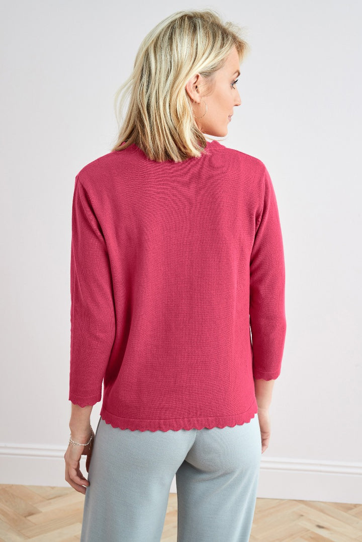 Lily Ella Collection elegant rose pink knit sweater with scalloped hem detail, casual chic three-quarter sleeve top styled with light grey trousers, fashionable comfortable women's wear