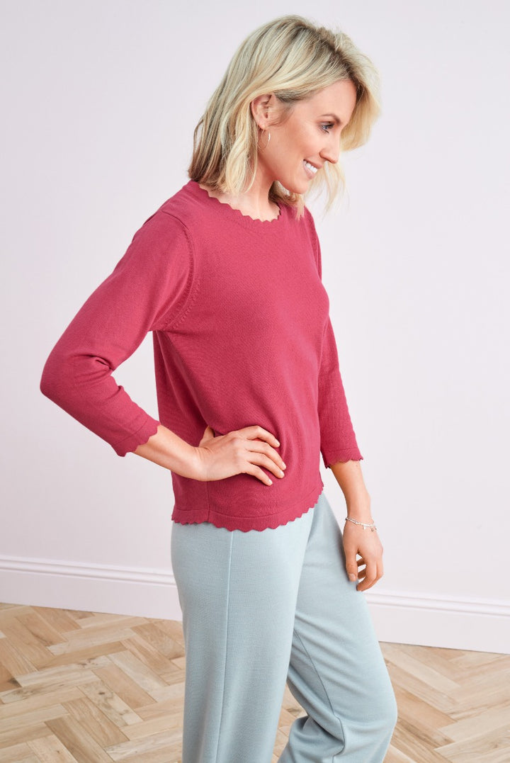 Lily Ella Collection elegant raspberry pink scalloped hem jumper paired with light teal trousers for a sophisticated women's fashion look
