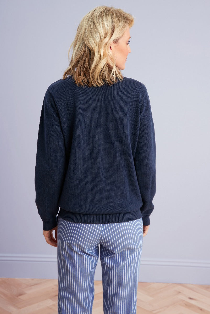 Lily Ella Collection navy blue knit sweater casual style with striped blue and white trousers for women's fashion.