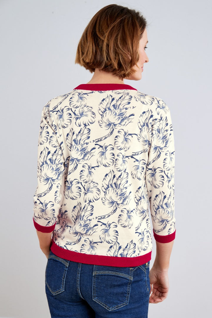Lily Ella Collection cream floral print sweater with ribbed red trim, stylish casual women's wear, rear view showing pattern and fit.