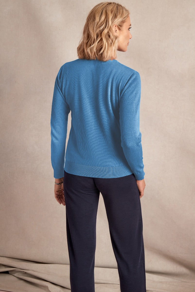 Lily Ella Collection blue knit sweater with ribbed detailing paired with elegant navy trousers, showcasing classy and comfortable women's fashion.