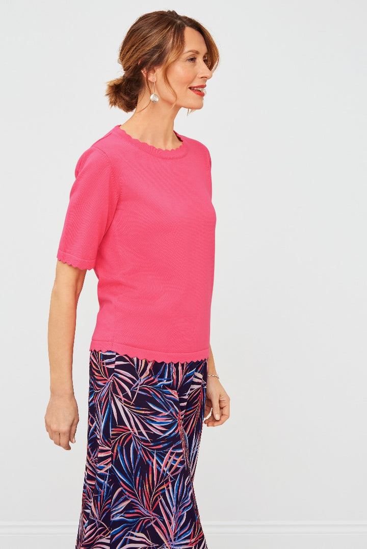 Lily Ella Collection pink scalloped edge knit top paired with a vibrant tropical print maxi skirt for a stylish and sophisticated women's summer outfit.
