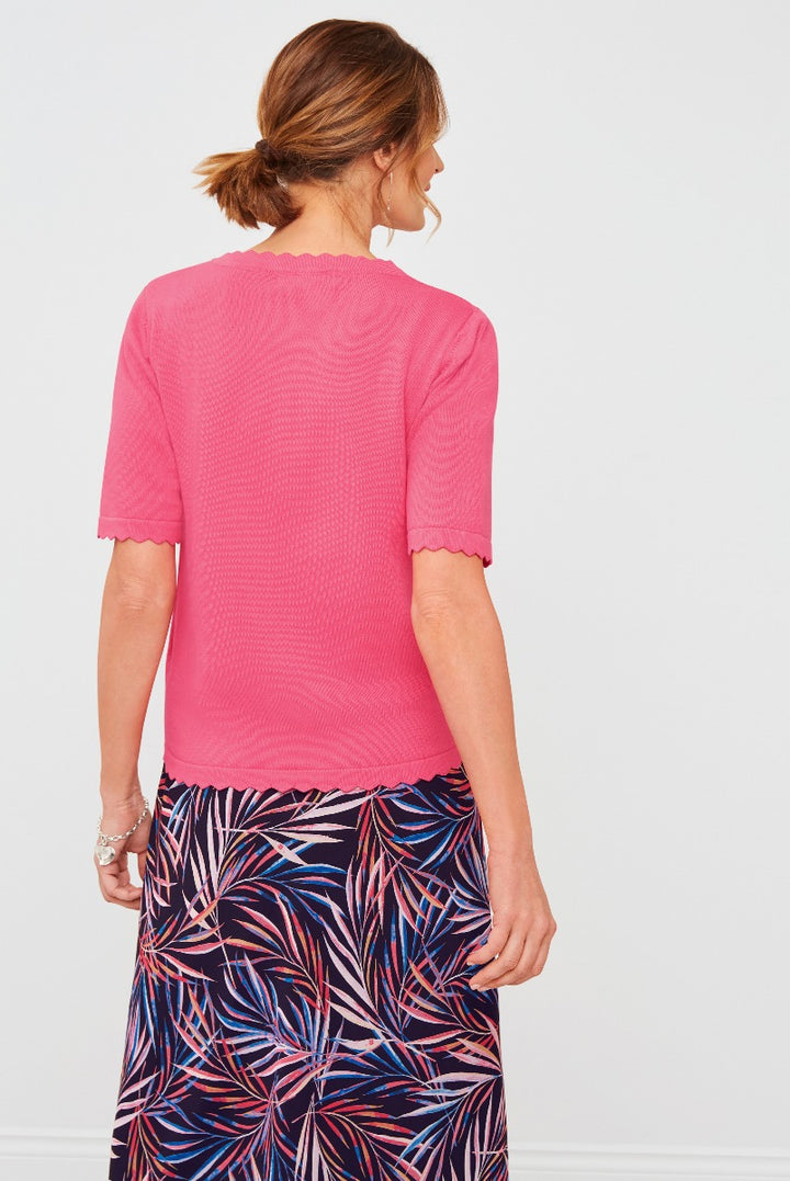 Lily Ella Collection vibrant pink scalloped-edge top paired with floral patterned skirt, showcasing stylish women's spring-summer fashion outfit, elegant casual wear.