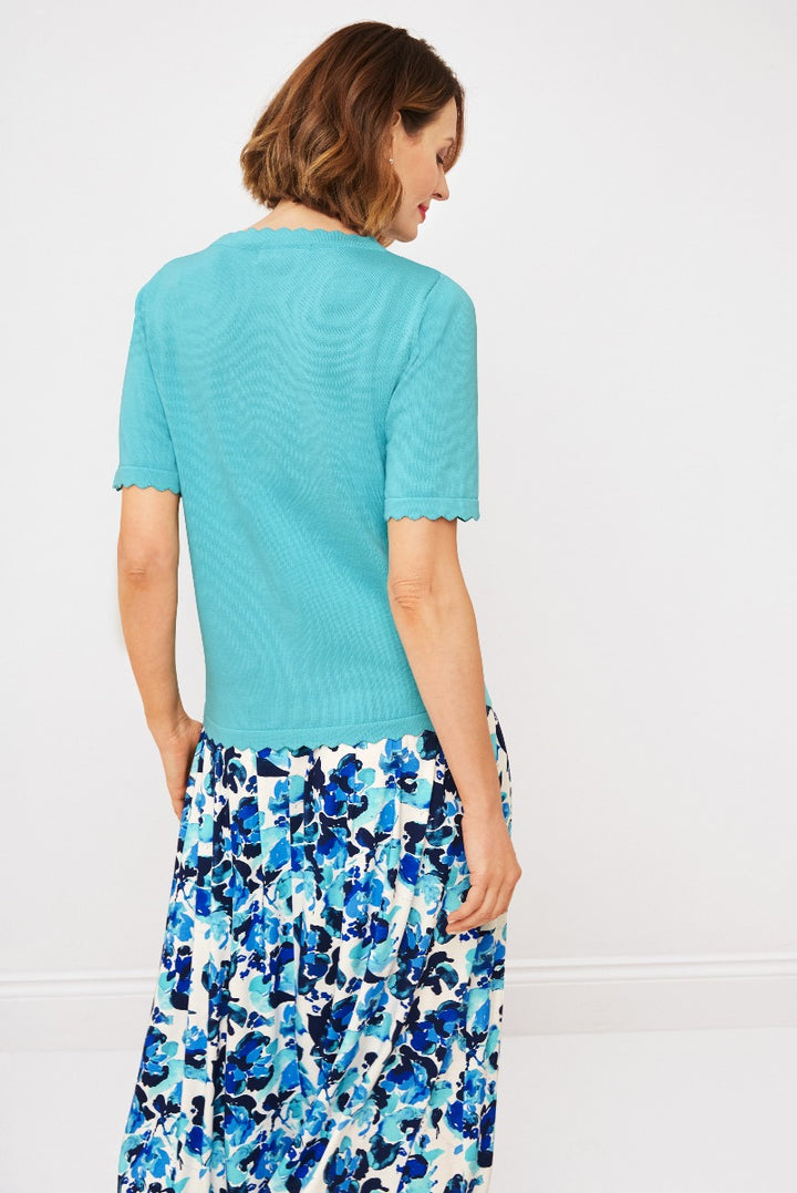 Lily Ella Collection turquoise scalloped-edge knit top paired with floral blue and white patterned skirt, stylish women's summer fashion.