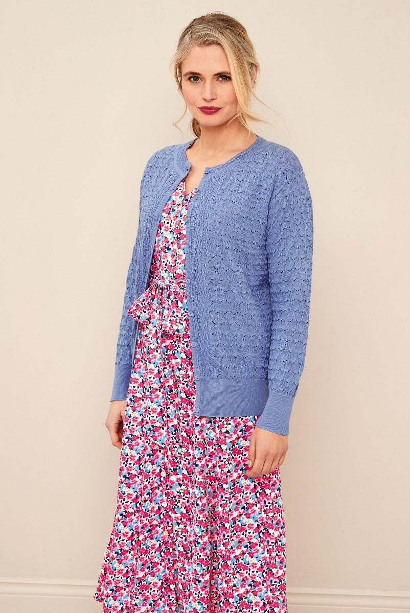 Lily Ella Collection stylish periwinkle blue knit cardigan paired with floral patterned dress, elegant women's fashion, spring attire, comfortable and trendy clothing ensemble.