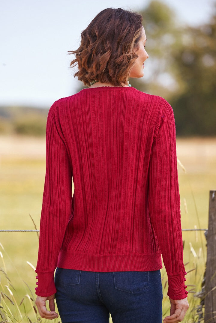 Lily Ella Collection red ribbed knit sweater with button cuff detail, casual chic women's fashion, outdoor autumn style.