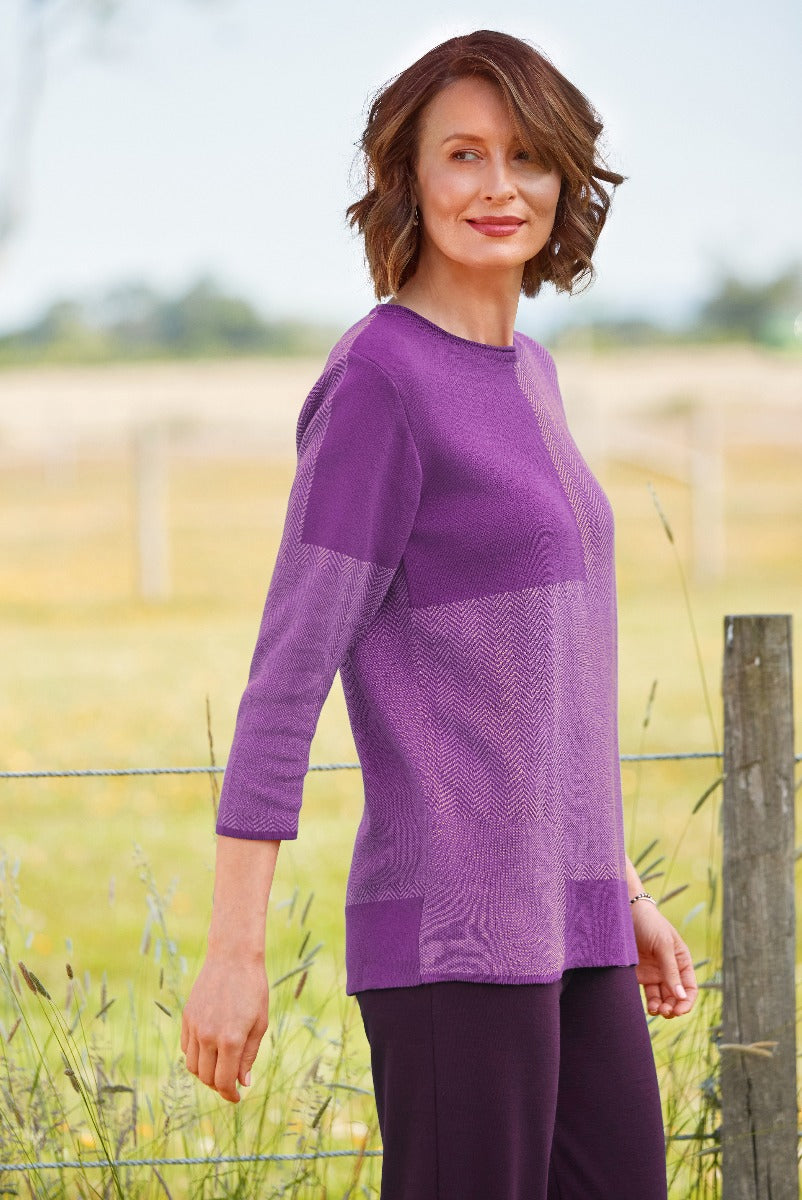 Lily Ella Collection stylish purple knitwear, three-quarter sleeves, women's textured jumper, elegant casual wear, outdoor fashion photography.