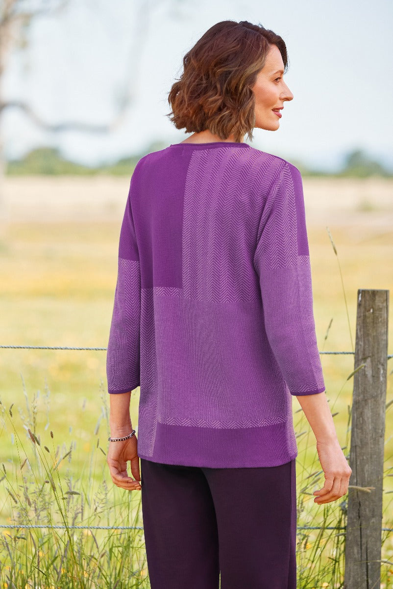 Lily Ella Collection elegant purple knitwear, women's fashion, chevron pattern, comfortable style, outdoor photoshoot.