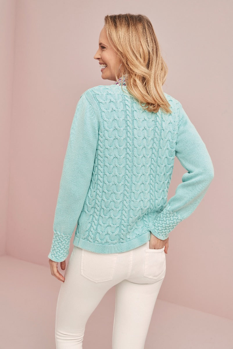 Lily Ella Collection light blue cable knit sweater, women's casual style, comfortable high-quality aqua pullover rear view, paired with white pants.