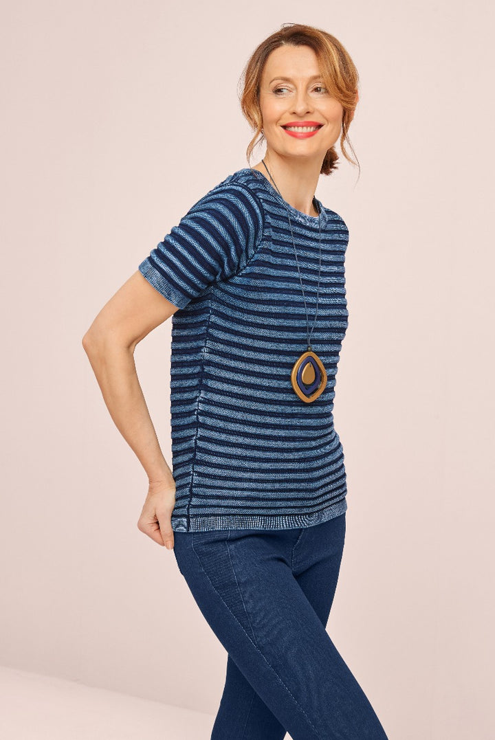 Lily Ella Collection navy blue and white striped tunic top, stylish casual wear for women, with accessory.