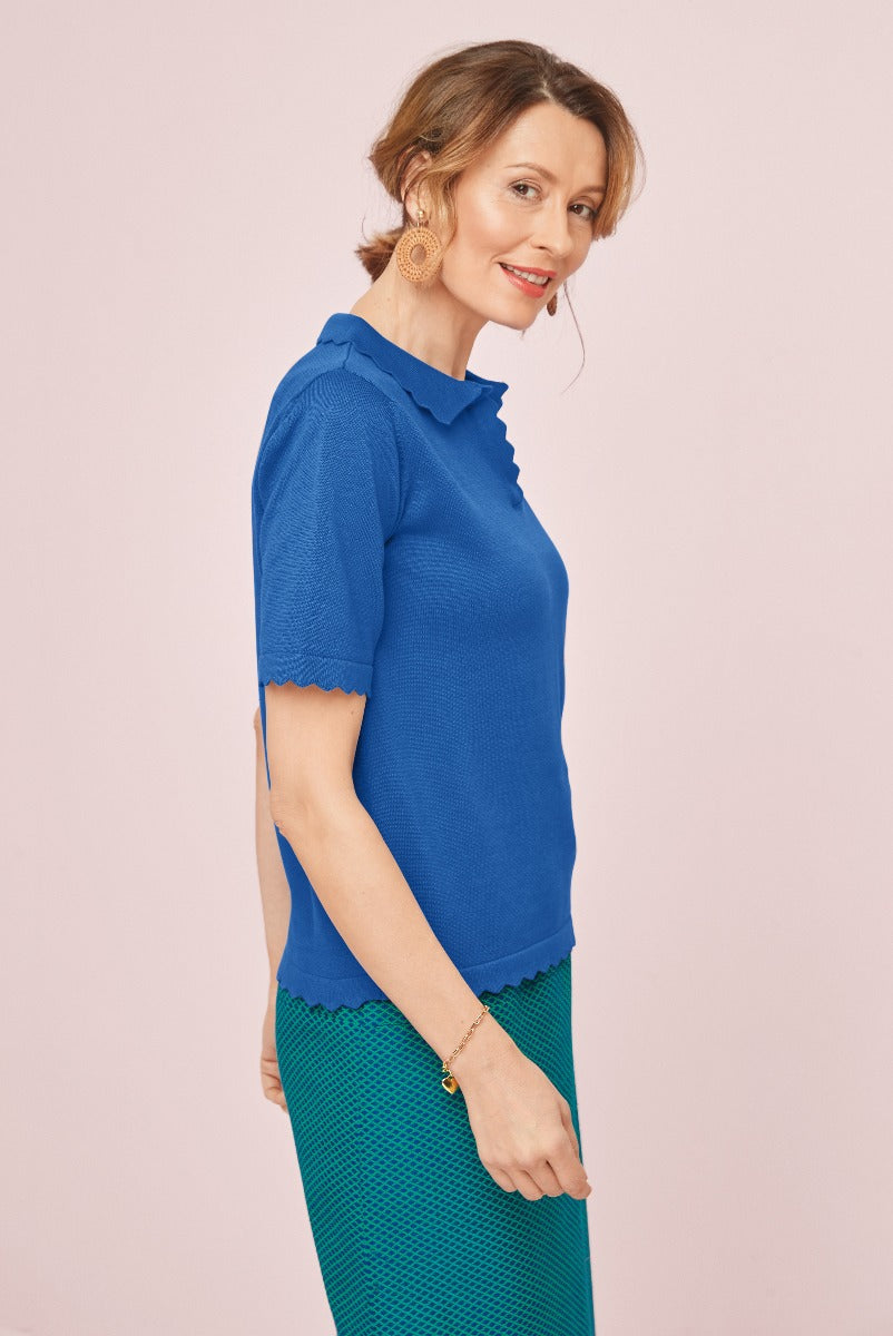 Lily Ella Collection elegant royal blue scalloped edge top with stylish ruffle neckline paired with green textured skirt, sophisticated casual wear for women.