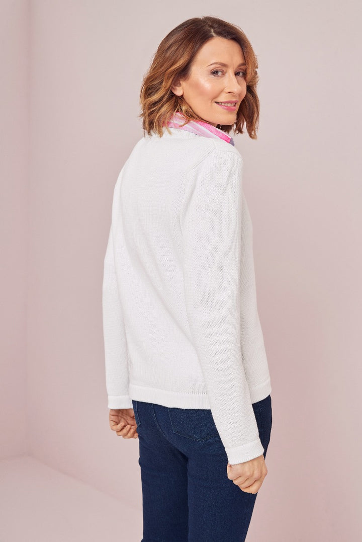 Lily Ella Collection white cable knit sweater with pink collar detail paired with classic blue jeans, stylish casual women's wear