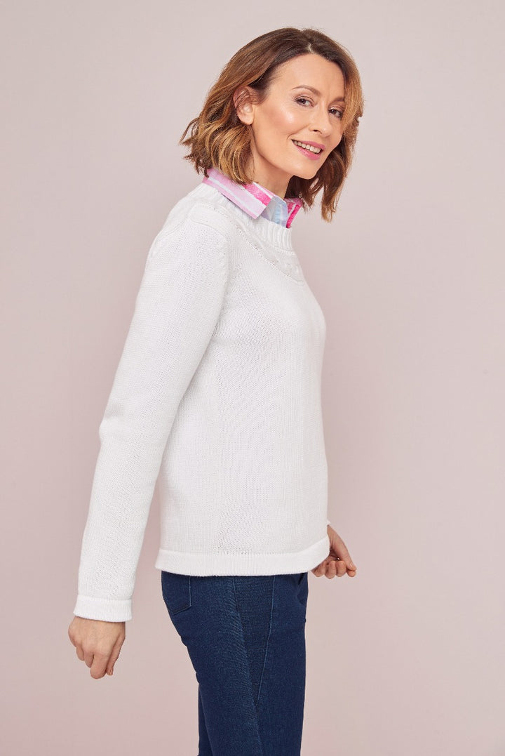 Lily Ella Collection women's white cable knit jumper with colorful collar detailing paired with blue denim jeans, stylish and comfortable casualwear for modern fashion-conscious women.