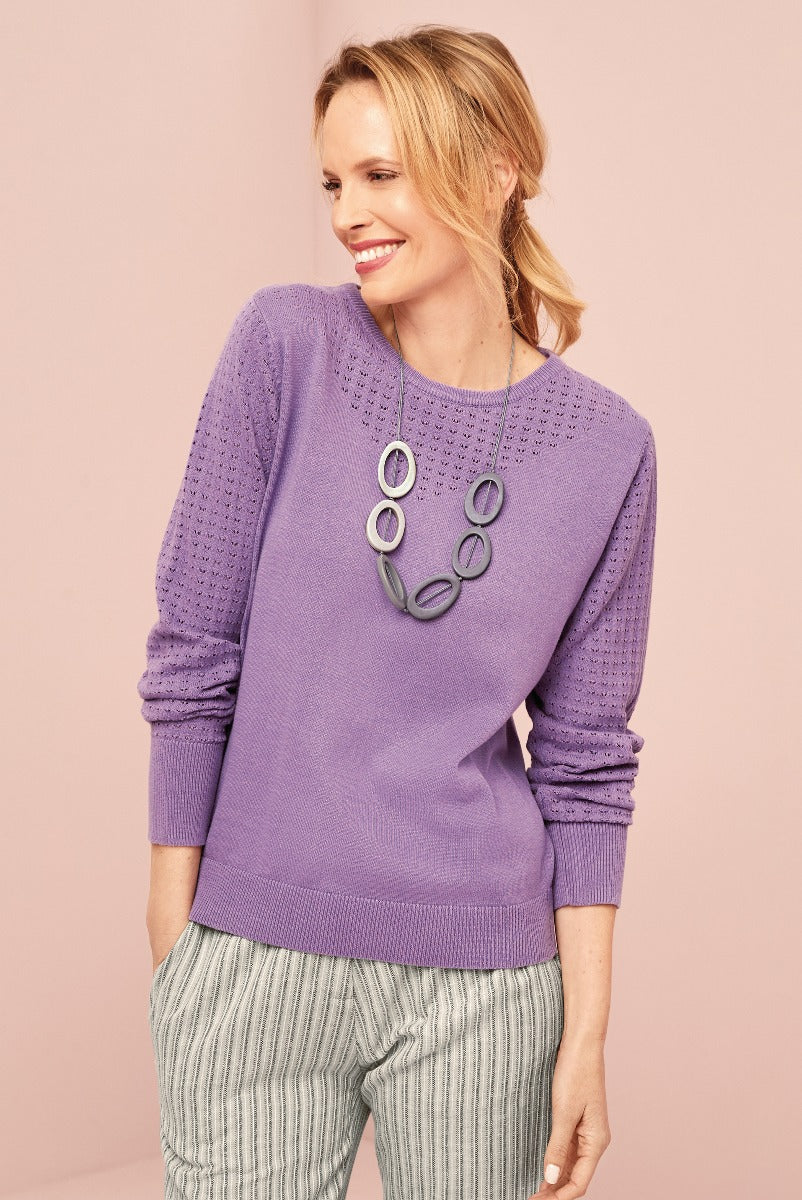 Lily Ella Collection stylish lavender knit jumper, eyelet detail, paired with casual striped trousers, accessorized with contemporary grey loop necklace, women's fashion apparel.