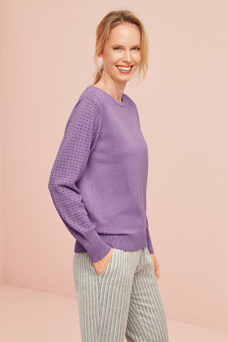 Lily Ella Collection women's lavender purple knitted jumper with patterned detail, paired with stylish striped trousers, smiling model in elegant everyday fashion outfit