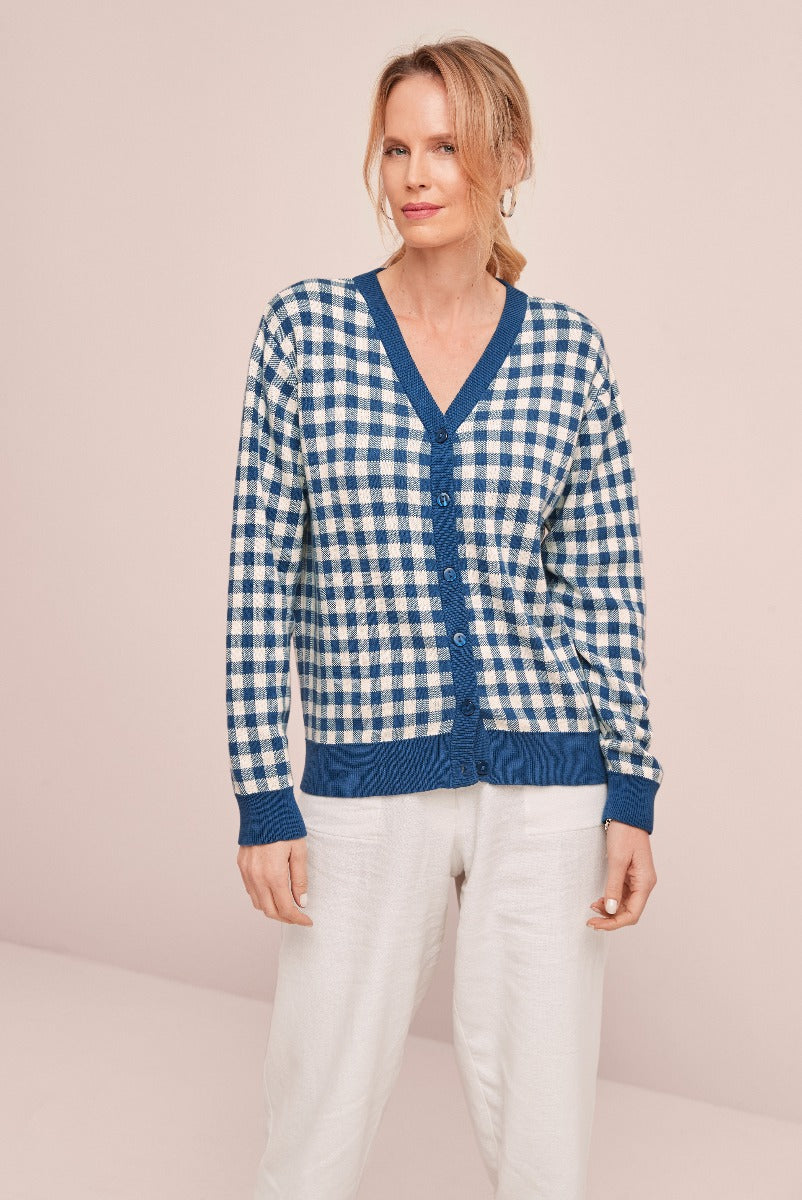 Lily Ella Collection blue and white checked cardigan, cozy knitwear, woman in casual chic style, comfortable linen trousers, fashion photoshoot.