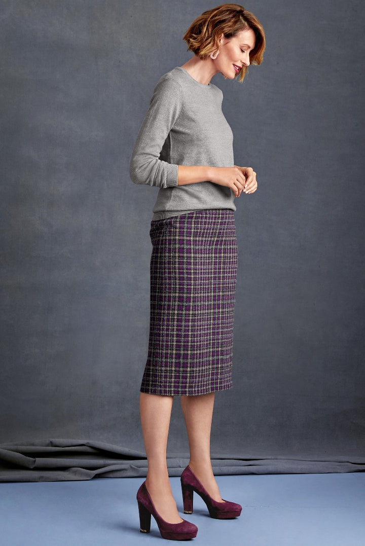 Lily Ella Collection elegant women's outfit featuring a light grey cashmere sweater and purple check pencil skirt with coordinated purple high heels, stylish professional female attire