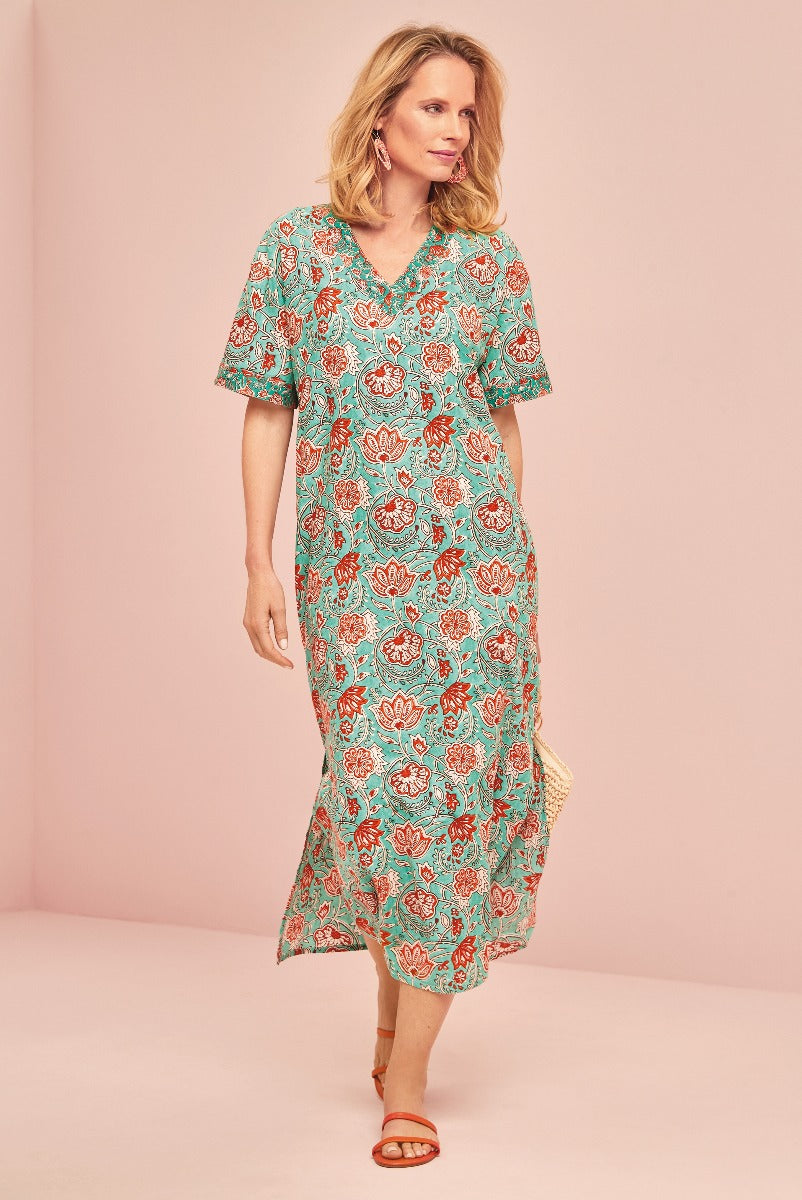 Lily Ella Collection aqua and coral floral print midi dress with v-neckline and short sleeves, styled with tan sandals, elegant women's summer fashion.