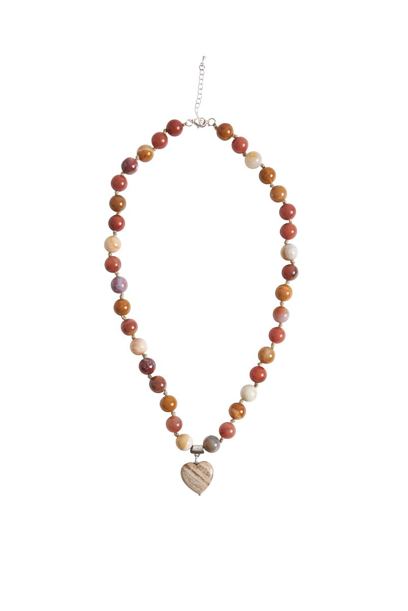 Lily Ella Collection multi-colored spherical bead necklace with heart pendant on white background.