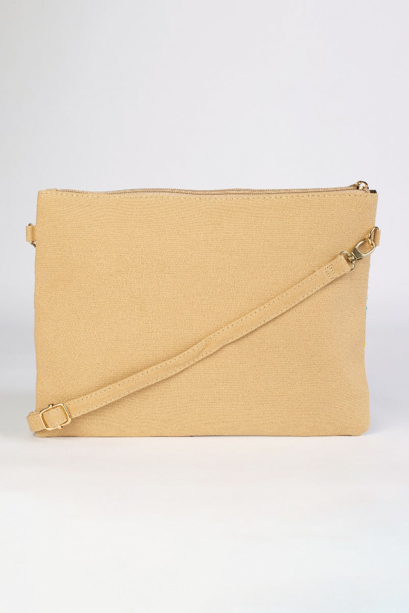 Lily Ella Collection beige canvas crossbody bag with adjustable strap, elegant women's fashion accessory, versatile and stylish for everyday use.