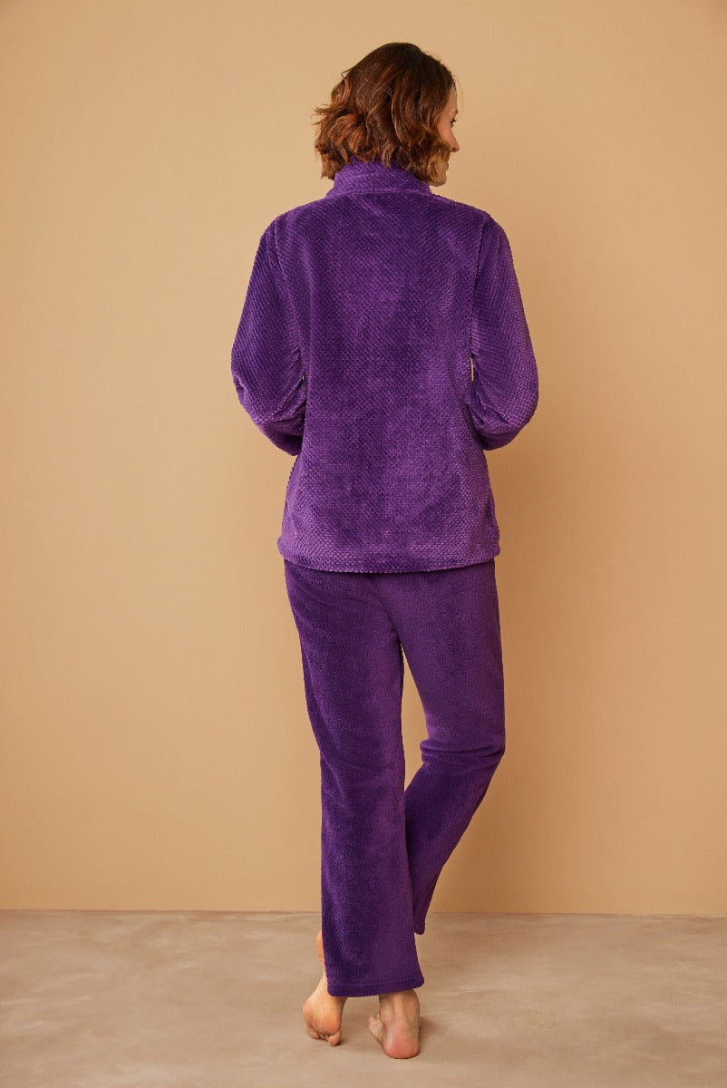 Lily Ella Collection womenswear, model showcasing purple velour tracksuit, cozy and casual style, rear view, soft texture, fashion and comfort for mature women.