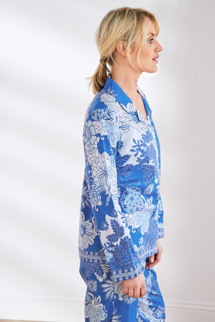 Lily Ella Collection blue and white floral patterned tunic top for women, side view, elegant casual wear, stylish modern clothing, intricate flower design, comfortable fashion.