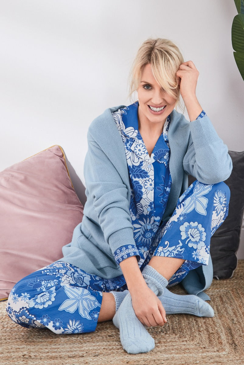 Lily Ella Collection woman smiling in cozy blue floral pattern loungewear set with matching cardigan, comfortable home fashion, elegant casual wear