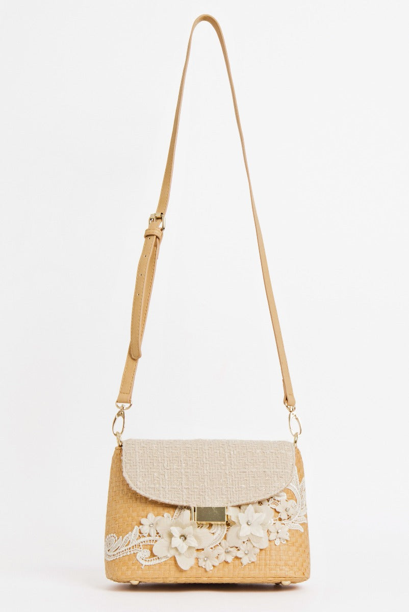 Lily Ella Collection beige straw crossbody bag with floral lace embellishments and adjustable tan leather strap, women's elegant summer accessory
