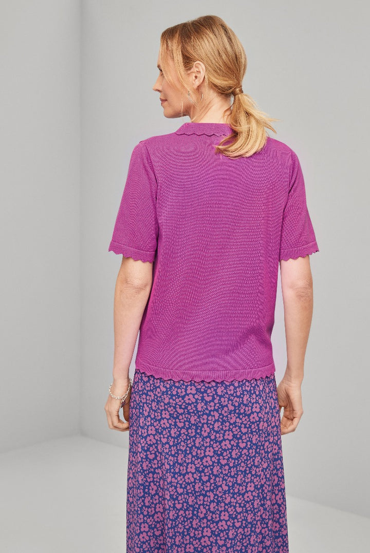 Lily Ella Collection magenta knit top with scalloped neckline and short sleeves paired with floral print skirt, showcasing women's spring fashion and elegant casual wear.