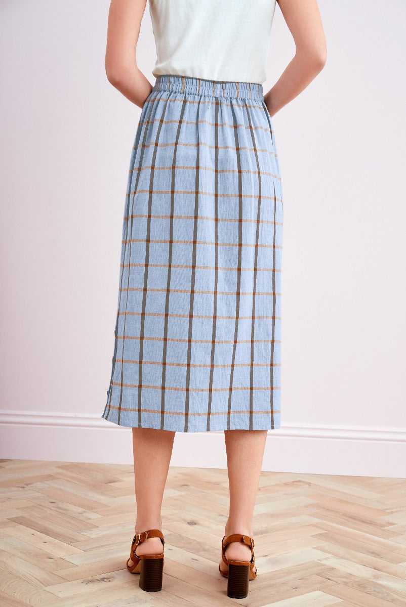 Lily Ella Collection blue and tan plaid midi skirt, women's spring fashion, comfortable elastic waist, versatile clothing piece, wooden heeled sandals, stylish outfit inspiration