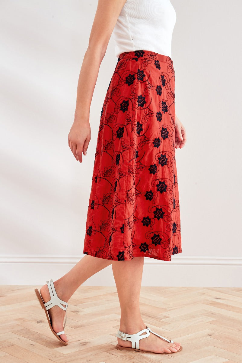 Lily Ella Collection red floral midi skirt with white top and summer sandals, stylish casual women's wear.