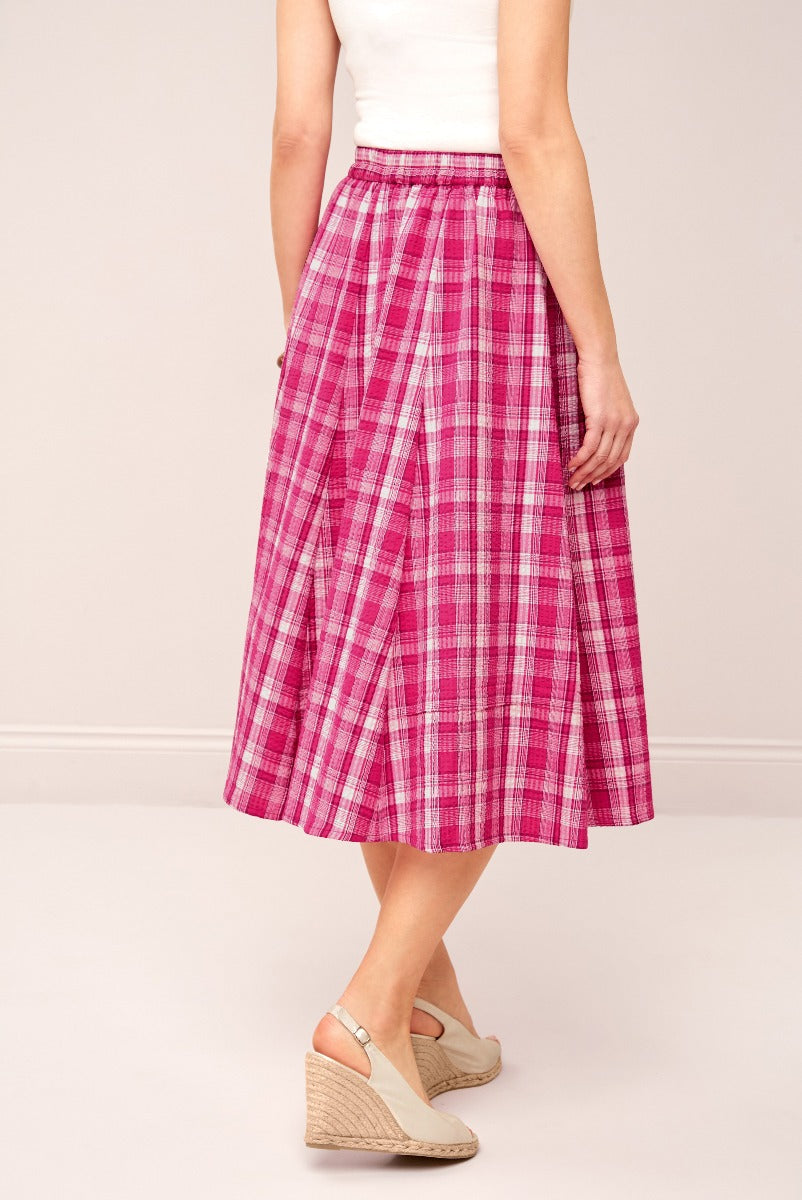 Lily Ella Collection pink plaid midi skirt for women, stylish summer checkered pattern skirt, casual yet fashionable outfit with beige wedge sandals
