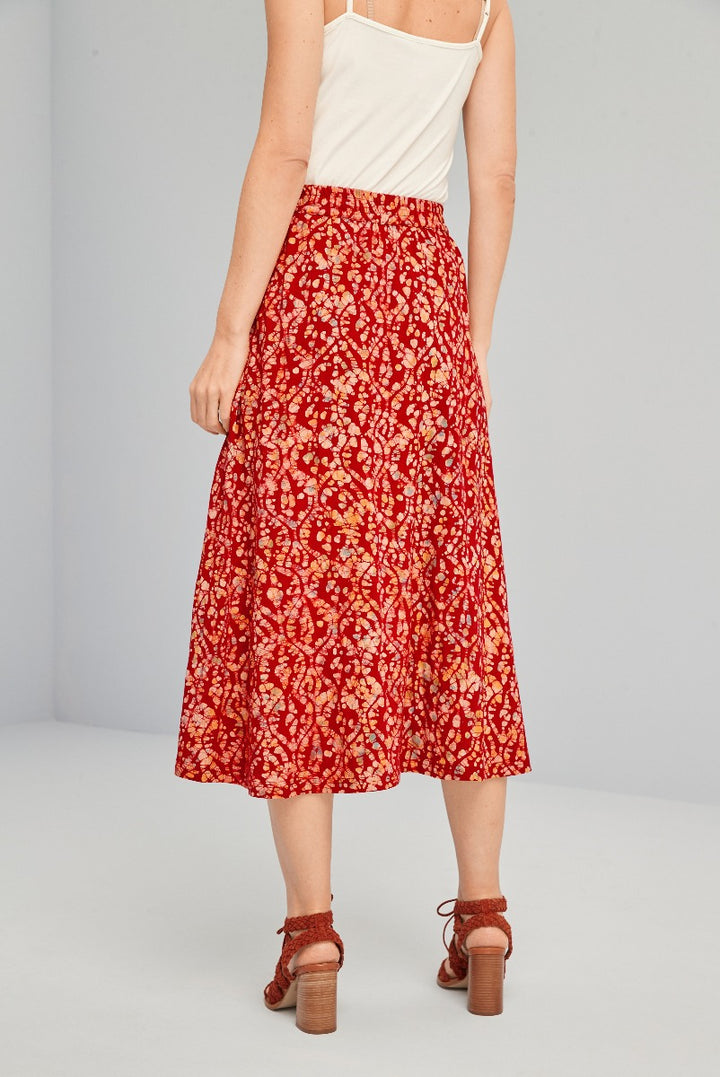 Lily Ella Collection red floral print mid-length skirt, women's fashion, spring collection, elegant style, white top pairing, versatile outfit idea, high heels.