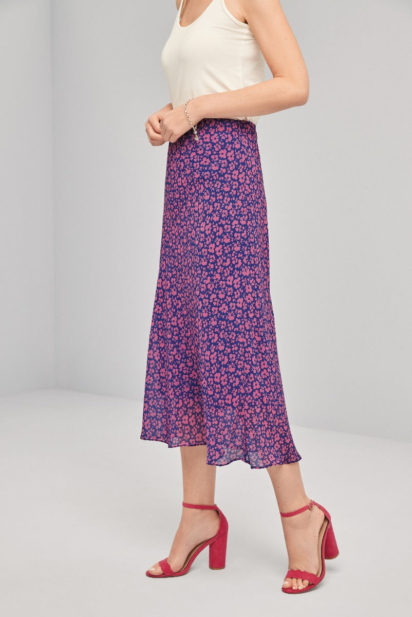 Lily Ella Collection elegant purple floral midi skirt paired with cream tank top and red strappy heels for a stylish feminine look