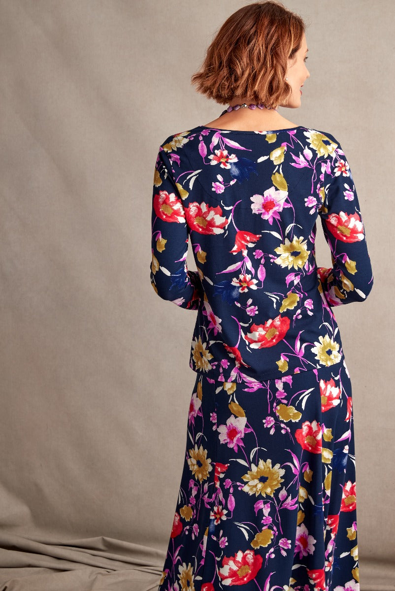 Lily Ella Collection navy blue floral dress, elegant long-sleeve midi dress with vibrant red, pink and cream flower pattern, stylish and comfortable women's fashion.