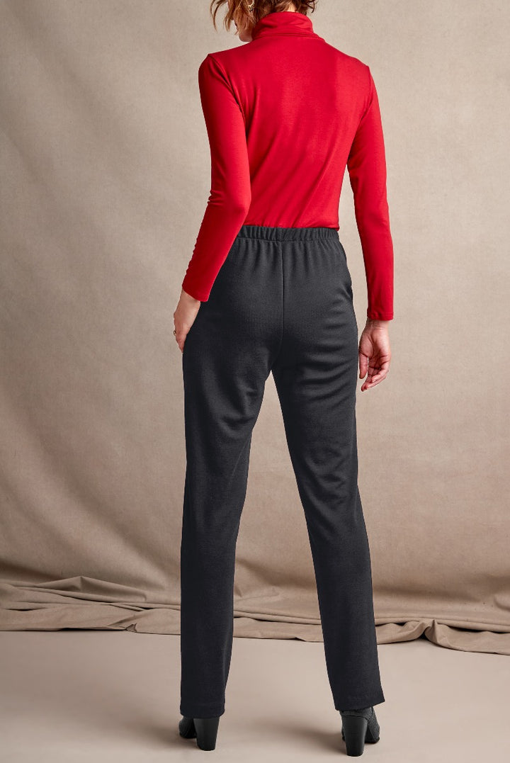 Lily Ella Collection elegant charcoal grey trousers paired with a vibrant red turtleneck top, showcasing the back view of sophisticated women's fashion for a professional and stylish look.