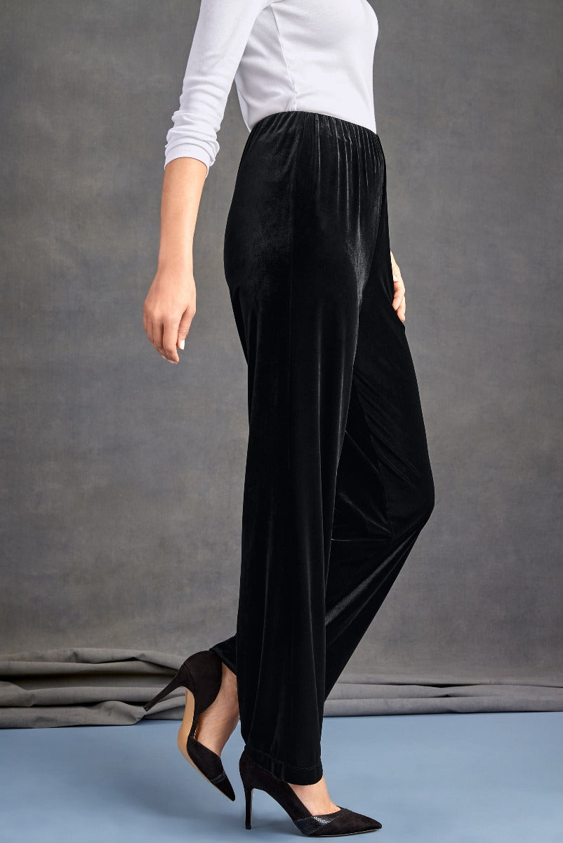 Lily Ella Collection elegant black velvet trousers, women's fashion, chic formal wear, comfortable elastic waist, paired with white top and black heels.