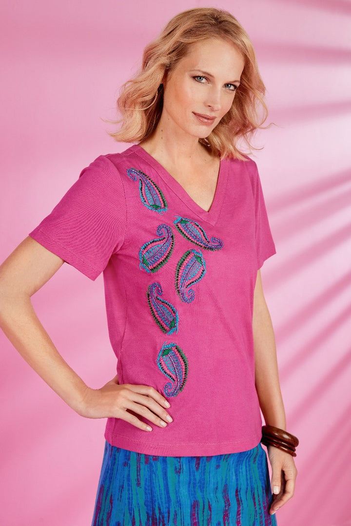 Lily Ella Collection vibrant pink V-neck t-shirt with decorative turquoise sequin embroidery, paired with a blue patterned skirt, stylish women's casual wear